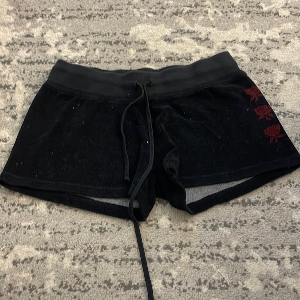Black hard tail shorts with roses on the side.